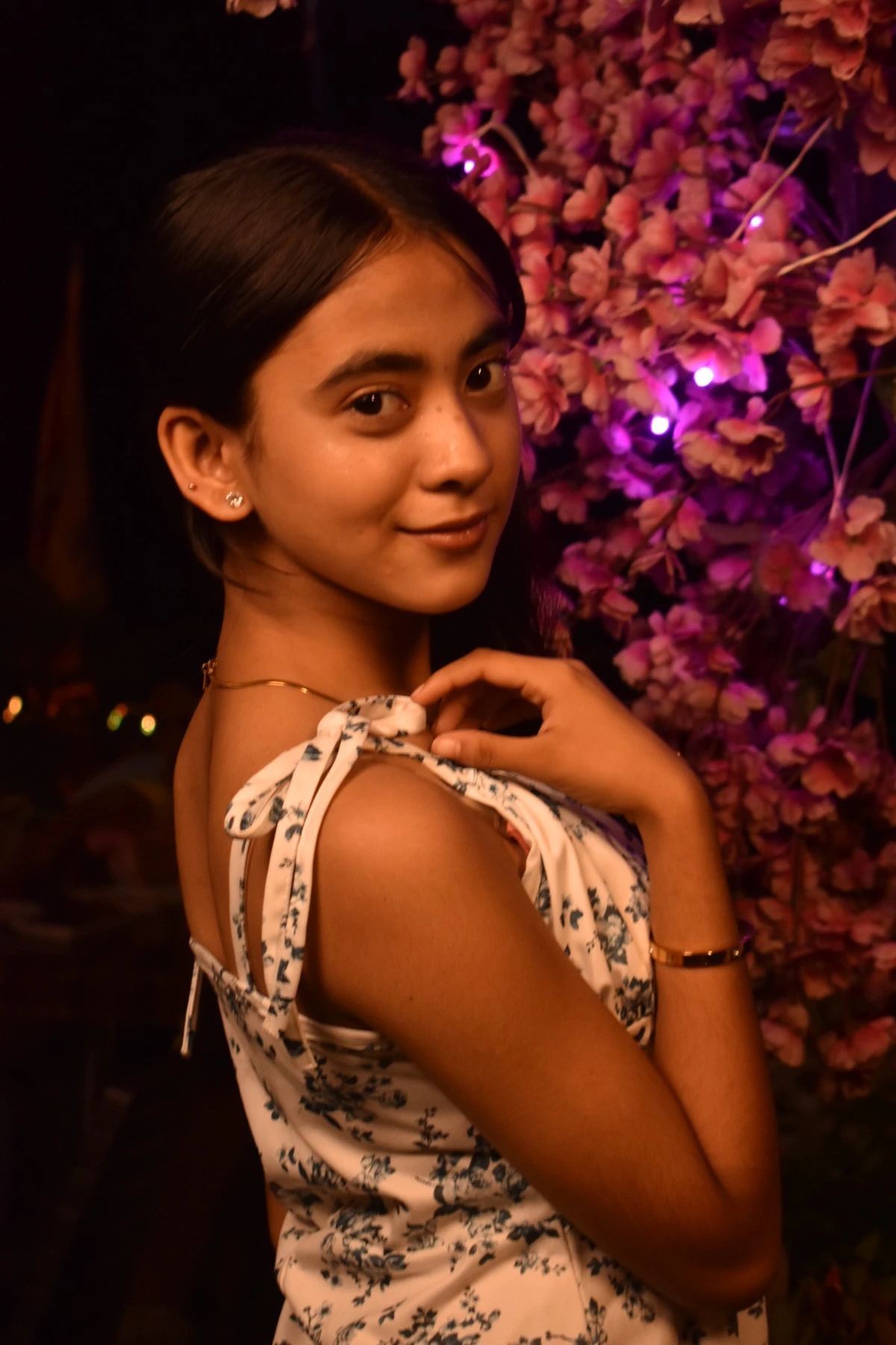 Portrait near decorative blossoms